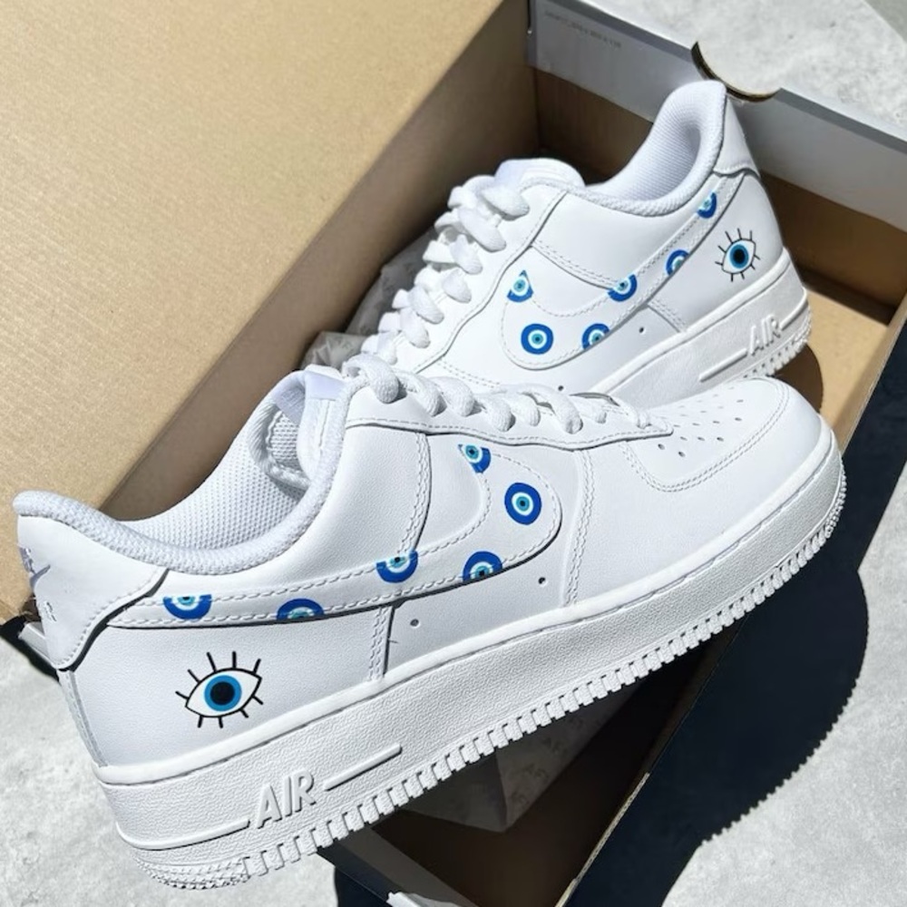 White Sneakers with Blue Eye Design